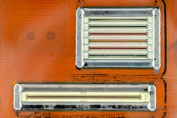 Macro shot of the printing nozzles in the inkjet printer head, seven nozzles visible.