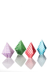 Origami balloons made of colored papers isolated on white background