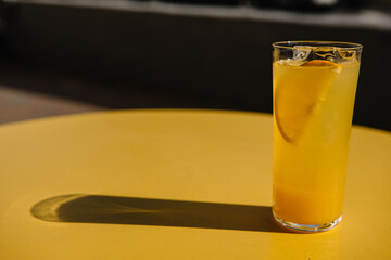 glass of lemonade on the yellow table