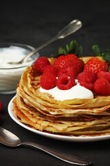 Russian cuisine national dish bliny with fresh berries	