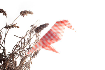 Obraz na płótnie Canvas Colored origami Birds on a perch isolated over white background.