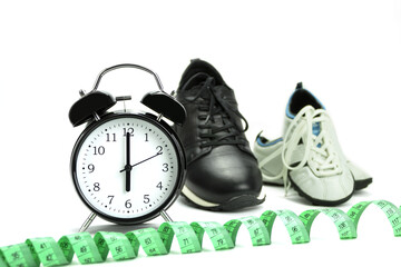 Alarm clock and krassovki on a white background