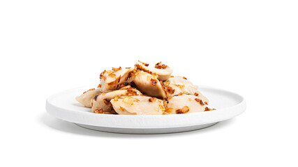 Dumplings with potatoes and fried onions in white plate isolated on a white background.