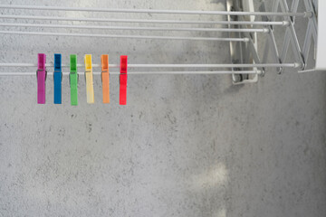 Six clothespins hanging together forming the rainbow color. LGBT concept.
