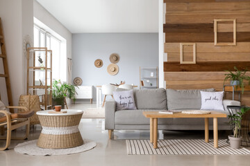 Stylish interior of living room with comfortable sofa