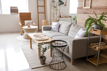 Stylish interior of living room with comfortable sofa