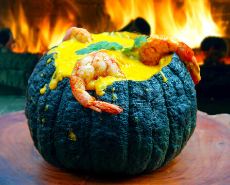 Prawns in Pumpkin (Camarao na Moranga) - Prawns with a creamy coconut milk sauce served inside a roasted pumpkin.