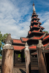 Red wooden temple in Myanmar