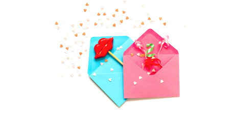 Pink and blue envelopes with decorative lips on stick. Festive concept or Romantic Love message. Creative copy space