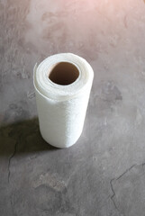 White kitchen paper towel rolls. Napkins on the table.
