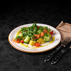 Salad with lightly salted salmon and potatoes with saffron sauce