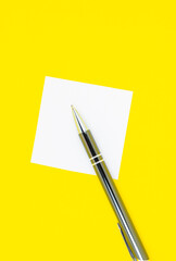 Blank white To Do List Sticker with pen. Searching information on the Internet..Close up of reminder note paper on the yellow background. Copy space. Minimalism, original and creative.