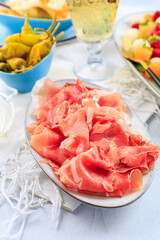 Prosciutto with grilled peppers -  Italian dry ham with grilled green peppers