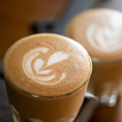 Cup of cappuccino with love. Rest break for two with natural coffee with painted heart on delicate foam. Romantic concept. Soft focus. Close up shot.