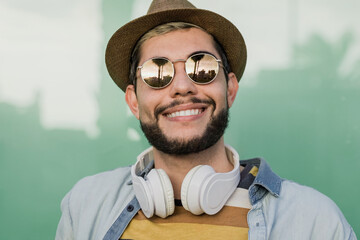 Portrait of hipster man having fun looking at camera - Focus on face