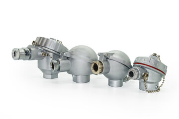Housings for temperature sensors of various types and sizes. Placed in a line, white background