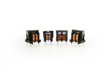 Ferrite core inductors with two windings, arranged in line. White background