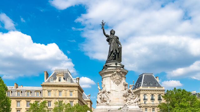     Paris, the beautiful Republic place, in the center, typical buildings in background 
