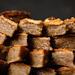 Juicy sweetness, Honey baklava. Traditional oriental dessert. Pieces of sweet puff pastry with walnuts. Food background. Soft focus. Close up shot.