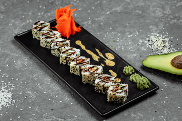 California Roll sushi with smoked eel, cucumber, avocado. Sushi menu. Japanese food