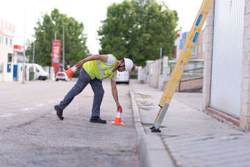 young technician at work marking work area