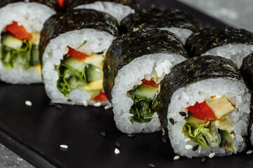 Vegetarian Maki Sushi - Roll made of Tomato, Cucumber, Bell Pepper, Salad Leaf and Japanese Mayonnaise