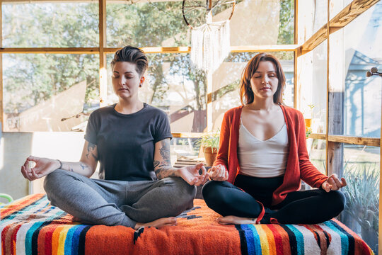 Women sitting and meditating together