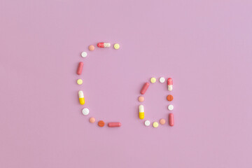 Calcium symbol made from pills on purple background. Top view with copy space. Flat lay.