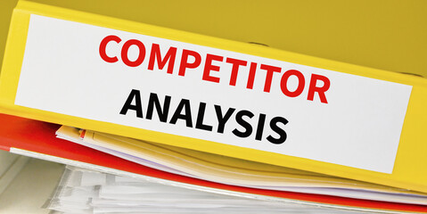 Competitor Analysis - Yellow Office Folder on another folder. Business and finances concept.