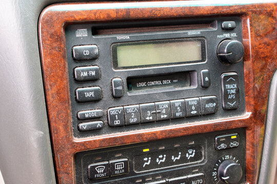Sochi Russia - June 6 2021: Old dusty radio tape recorder for playing CDs and cassettes in a Japanese Toyota car.