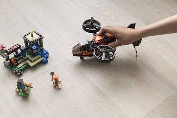A boy plays collects from the constructor of the helicopter