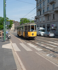 Famous vintage yellow tram.Public transport in Milan, Lombardy, Italy.