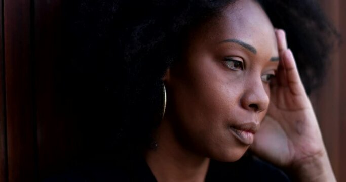 Preoccupied African woman, anxious suffering person