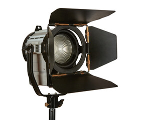 Constant light illuminator with curtains and fresnel lens on a stand for filming movies. The device...