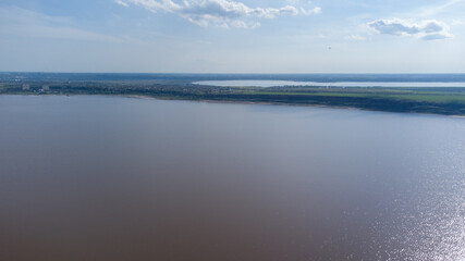 Fototapeta premium The bottom of a dried up salt lake. View from the air. Traces of cars and motorcycles in the sand.