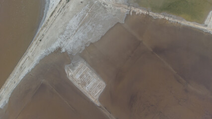 The bottom of a dried up salt lake. View from the air. Traces of cars and motorcycles in the sand.