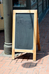 Fototapeta na wymiar Blank chalkboard on a sidewalk in San Diego, CA