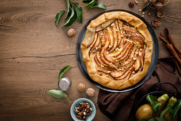 Pear galette with walnuts, cinnamon and lemon zest, autumn fruit pie with nuts