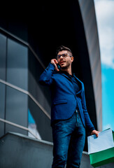 Handsome businessman walking on the street