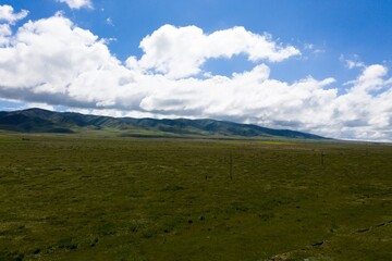 Clouds and mountains by Qinghai lake in summer
