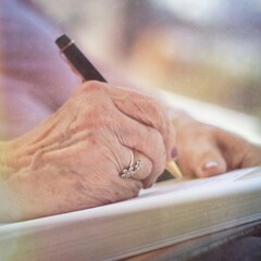 Old Woman Writing With Ring