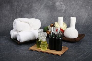 Thai massage with accesories for Asian spa with aroma herb and essential oil for skin. Hot compress ball for body and face care.