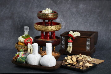 Thai massage with accesories for Asian spa with aroma herb and essential oil for skin. Hot compress ball for body and face care.