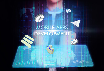 Business, Technology, Internet and network concept. Young businessman working on a virtual screen of the future and sees the inscription: Mobile apps development