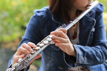 Flute classical instrument player playing song. Instructor practicing bronze woodwind for orchestra...