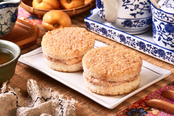 Rice burger with salmon, cheese on a white plate