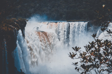Devil's Throat in Iguazu Falls with reddish water