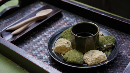 Warabi mochi, japanese soft glutinous rice with sweet sticky sauce for dipping wth cake. Green tea and Hojicha mochi.