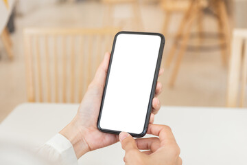 cell phone blank white screen mockup.woman hand holding texting using mobile on desk at office.background empty space for advertise.work people contact marketing business,technology