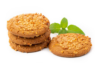 Oatmeal cookies with a green mint leaf on a white background. Diet food.
